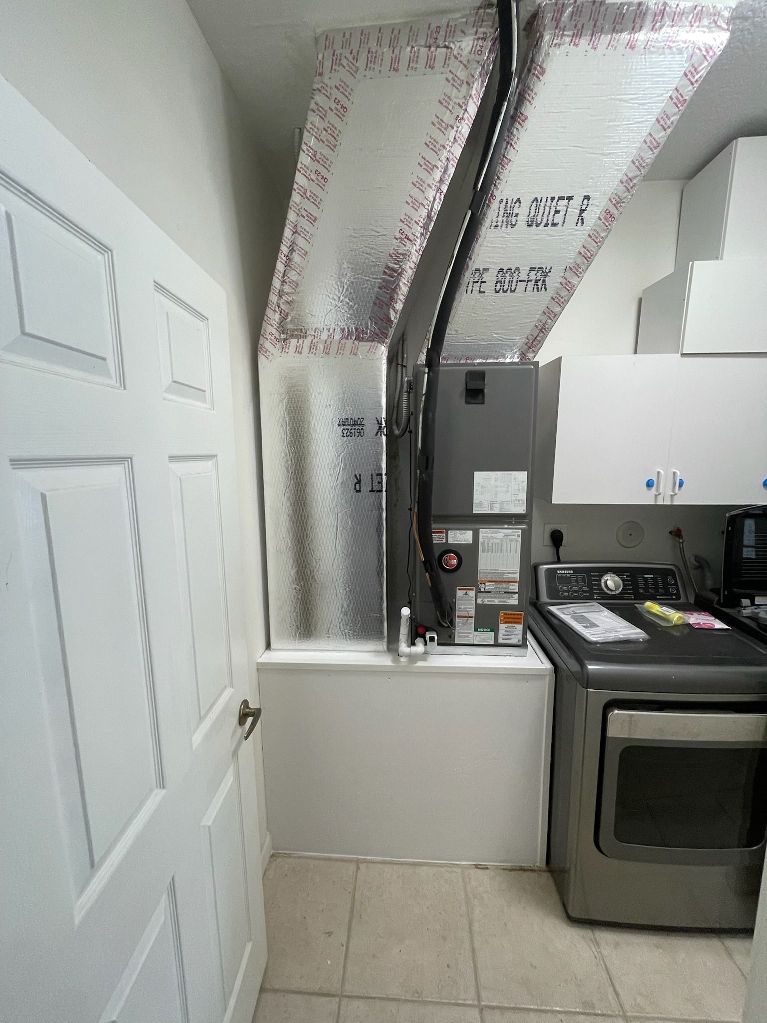 Air handler on a platform in a laundry room