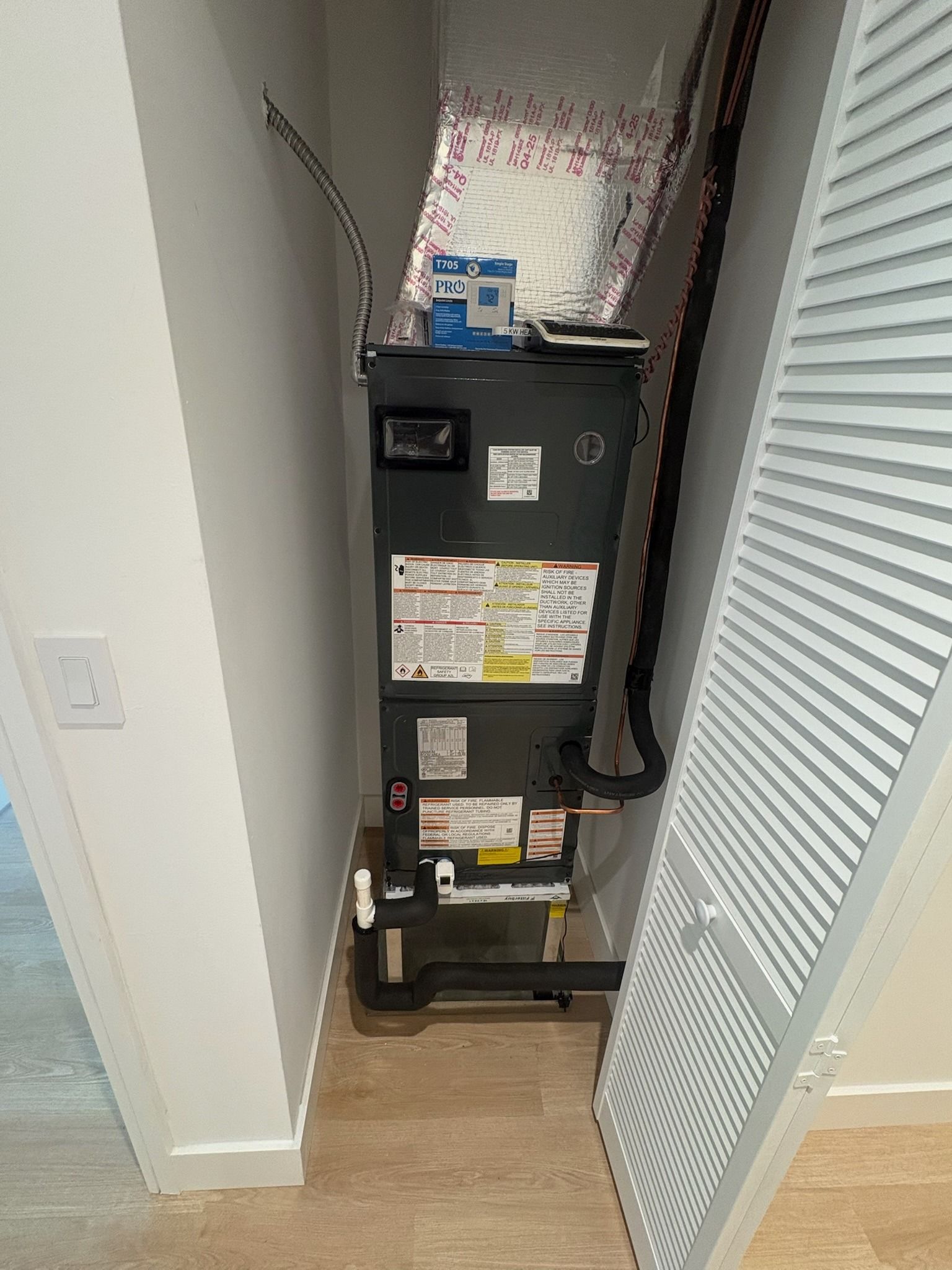 Air handler in a louvered closet in a new home