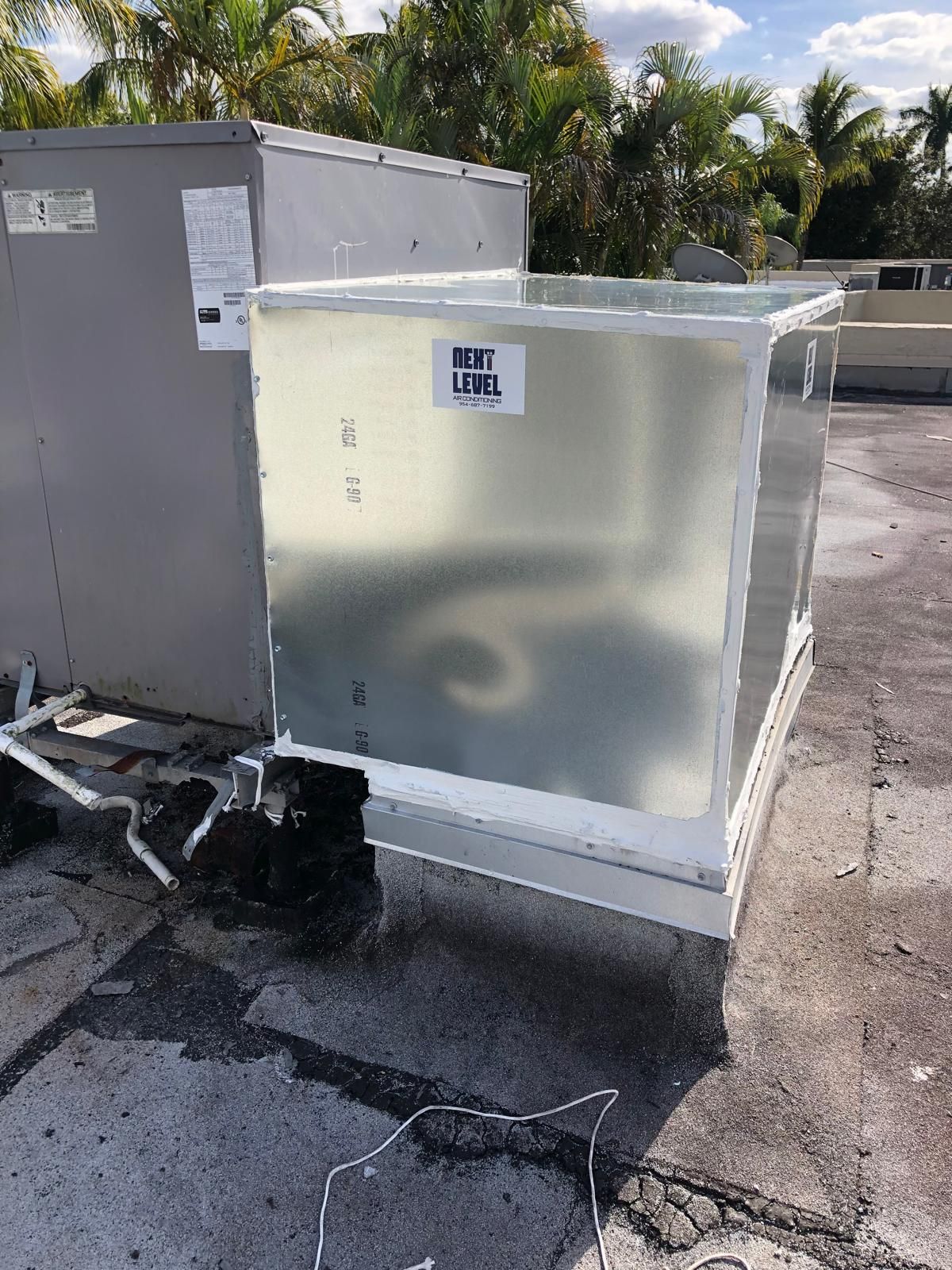 Fabricated curb and plenum sealed into a flat roof