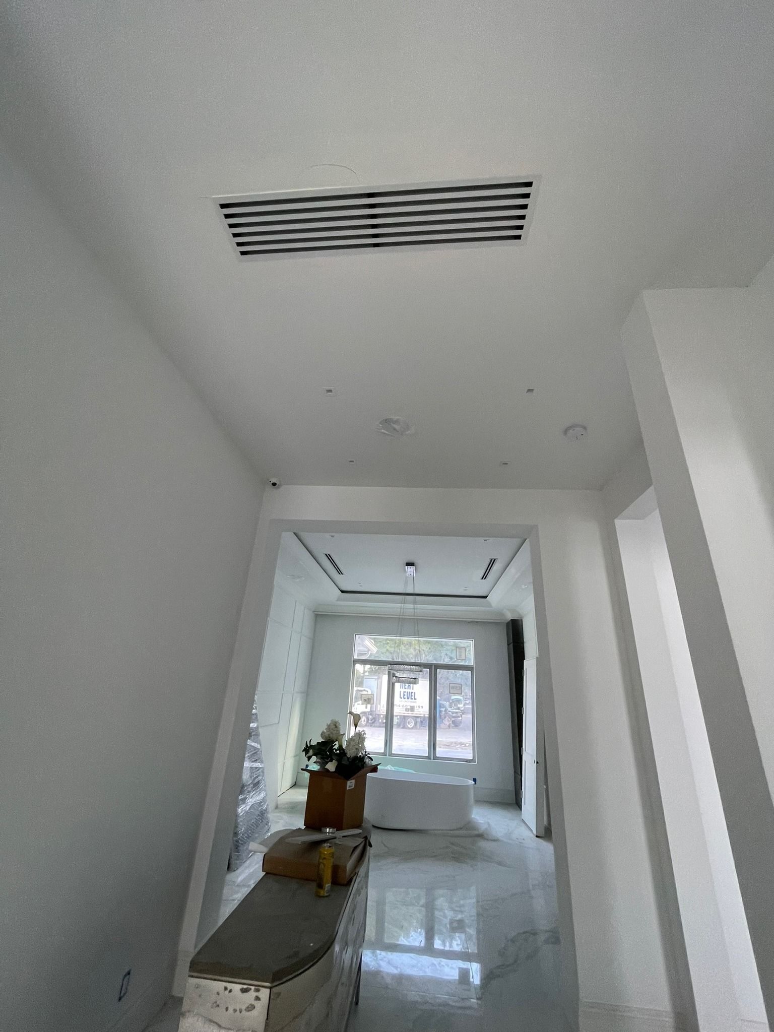 Linear diffuser in the hallway ceiling of a new home