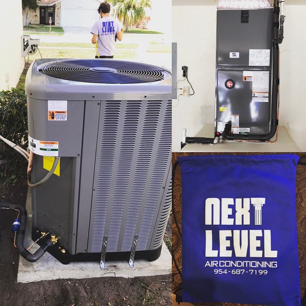 New condenser and Rheem air handler with a branded drawstring bag, technician walking to the van