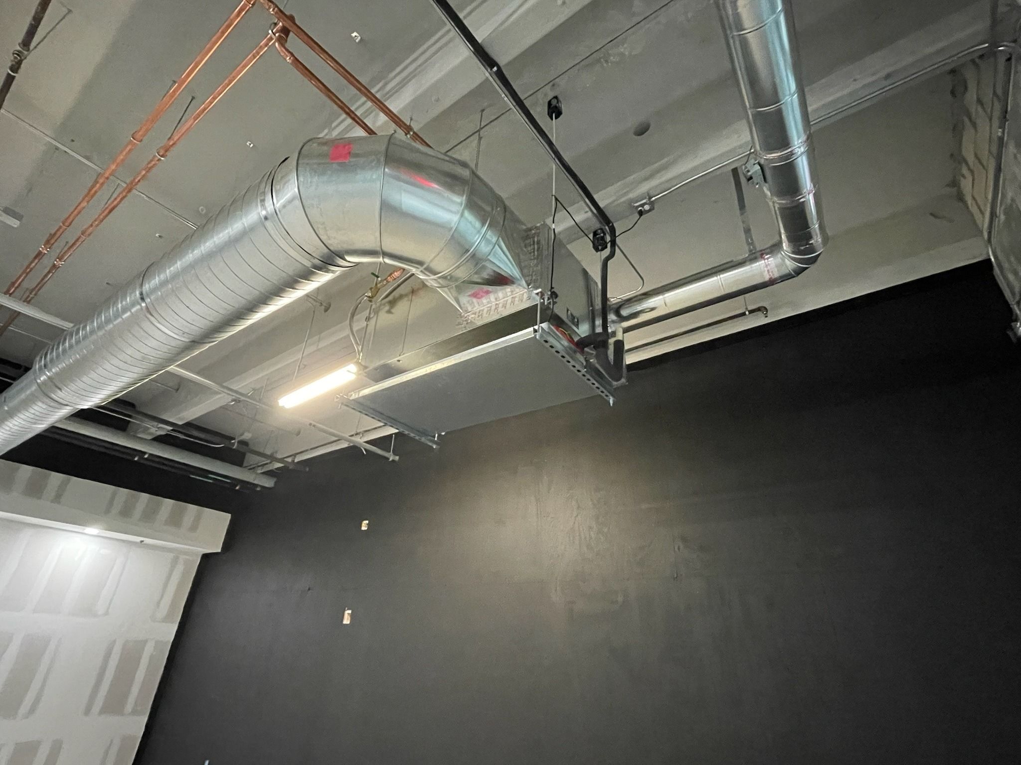 Exposed spiral duct run through a commercial build-out in Fort Lauderdale