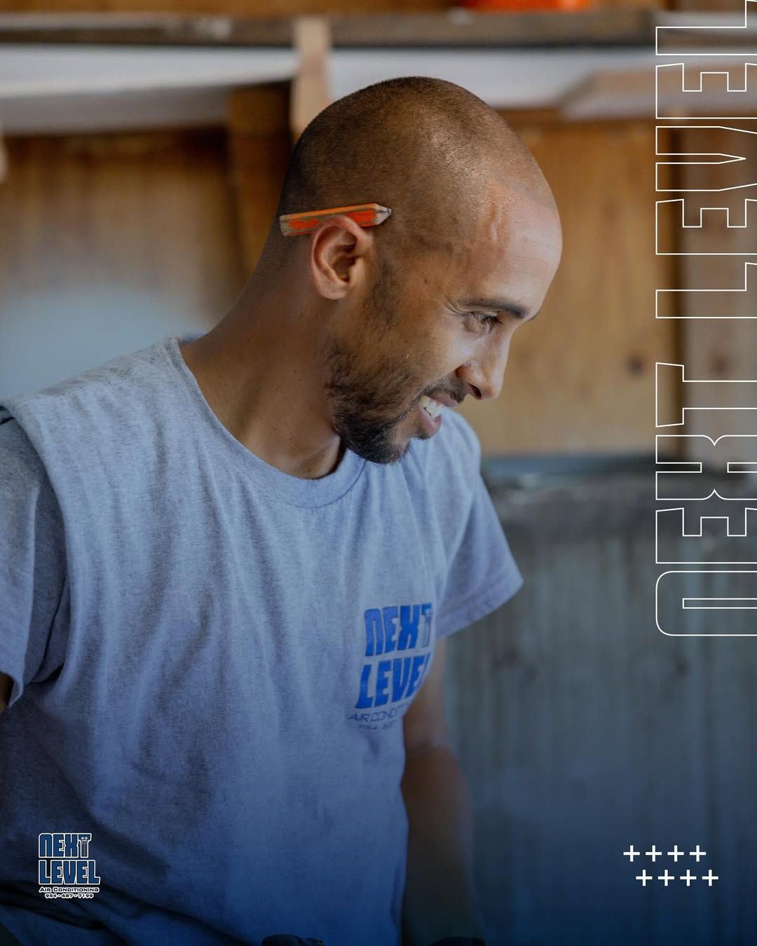 Profile portrait of a technician in a Next Level tee with a pencil behind his ear. Best single portrait in the archive