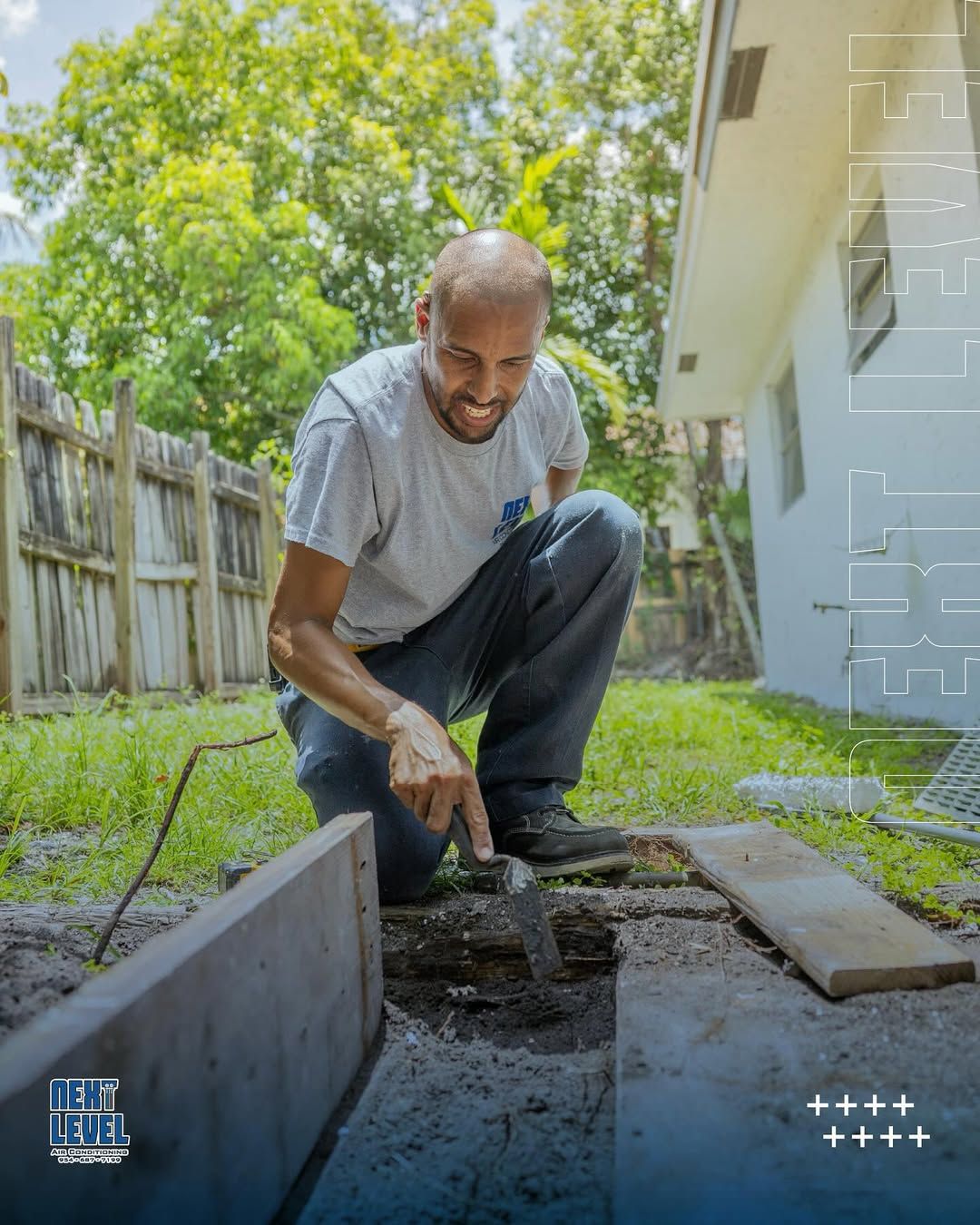 Technician setting a timber form for an equipment pad in a back yard