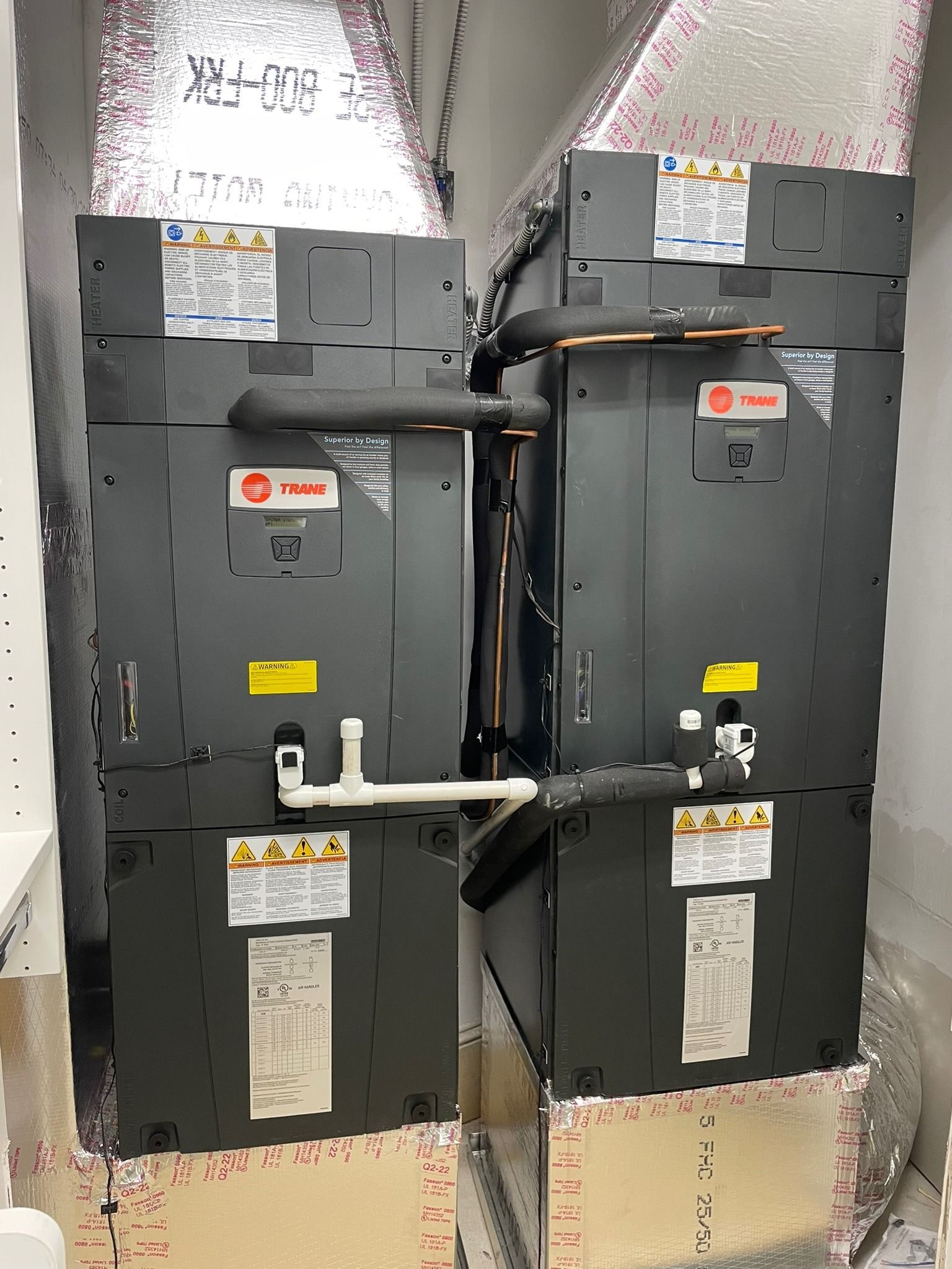 Pair of Trane air handlers side by side in a closet, Next Level Air Conditioning job in Boca Raton, 2022