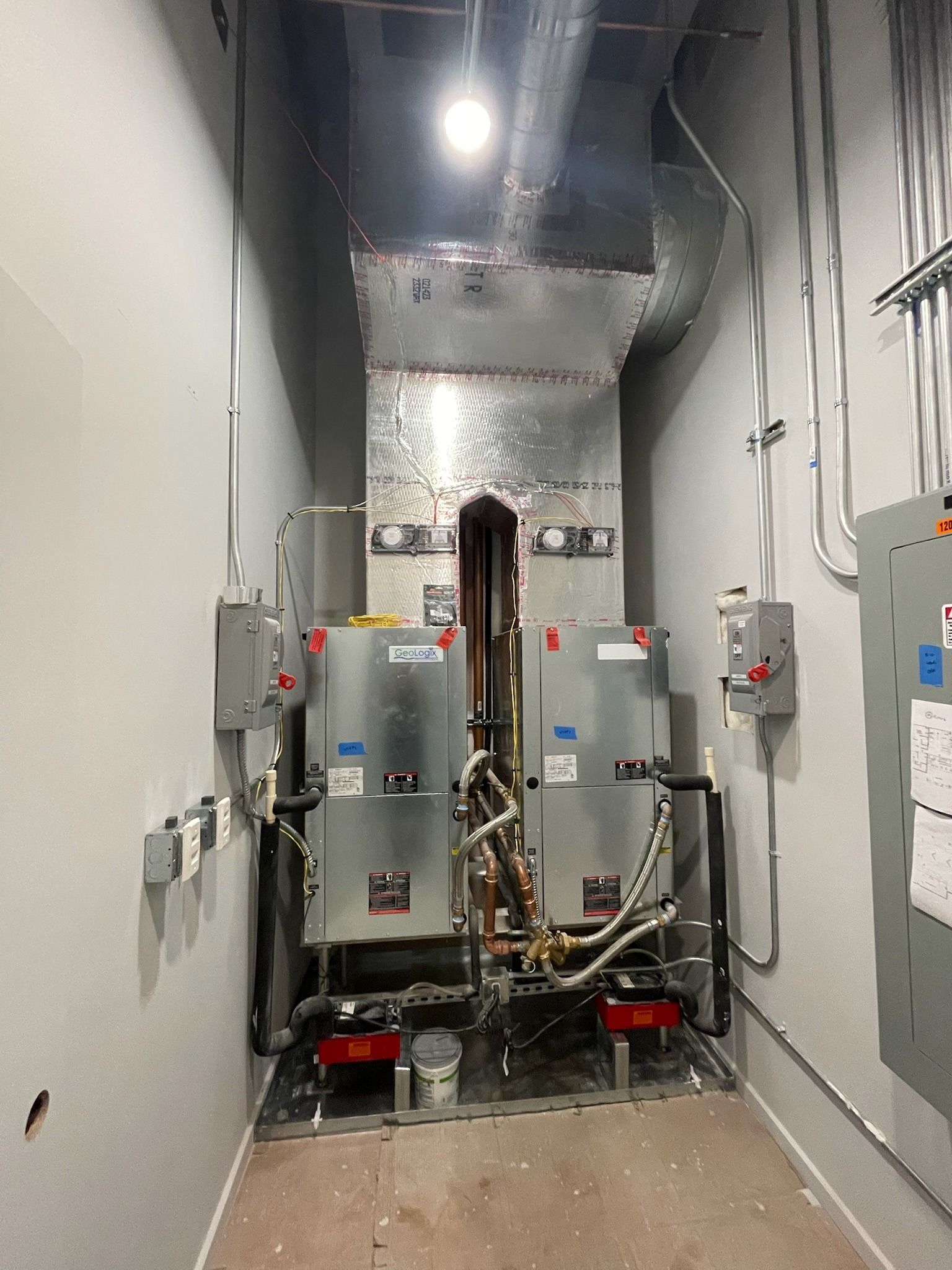 Two new air handlers side by side in a commercial mechanical room in Fort Lauderdale