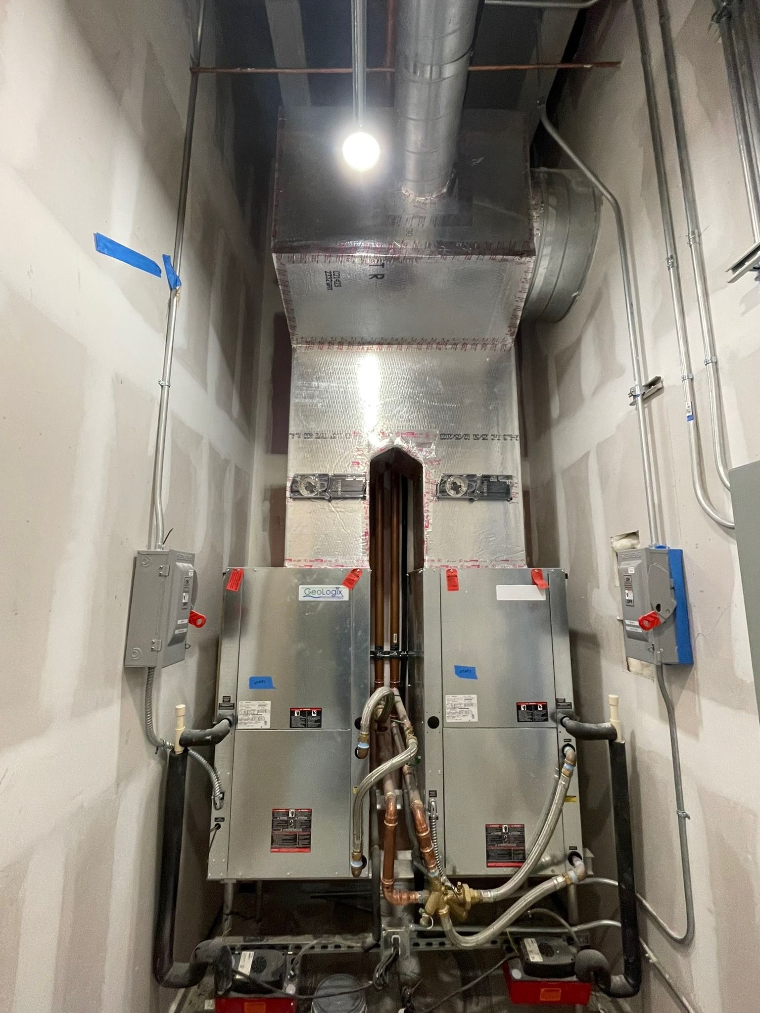 Twin vertical air handlers in a commercial mechanical room, Next Level Air Conditioning job in Fort Lauderdale, 2024