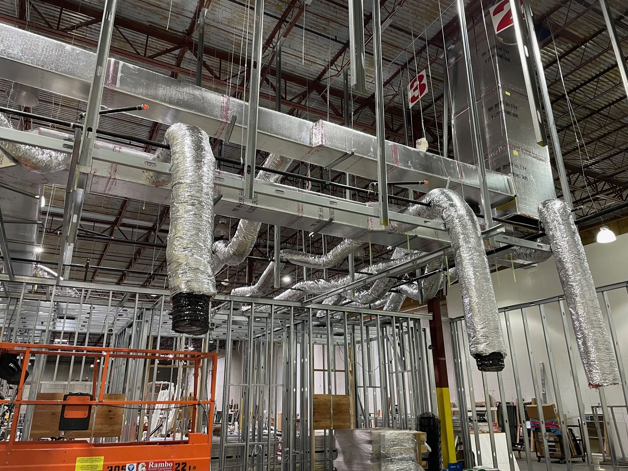 Duct trunk with insulated flex drops in a warehouse build-out